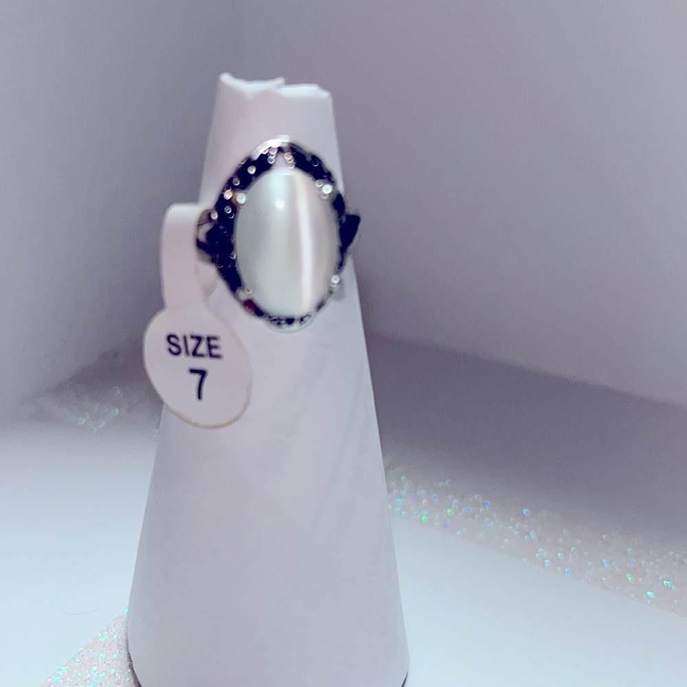 Silver toned Bohemian style ring with white moonstone and black crystal accents